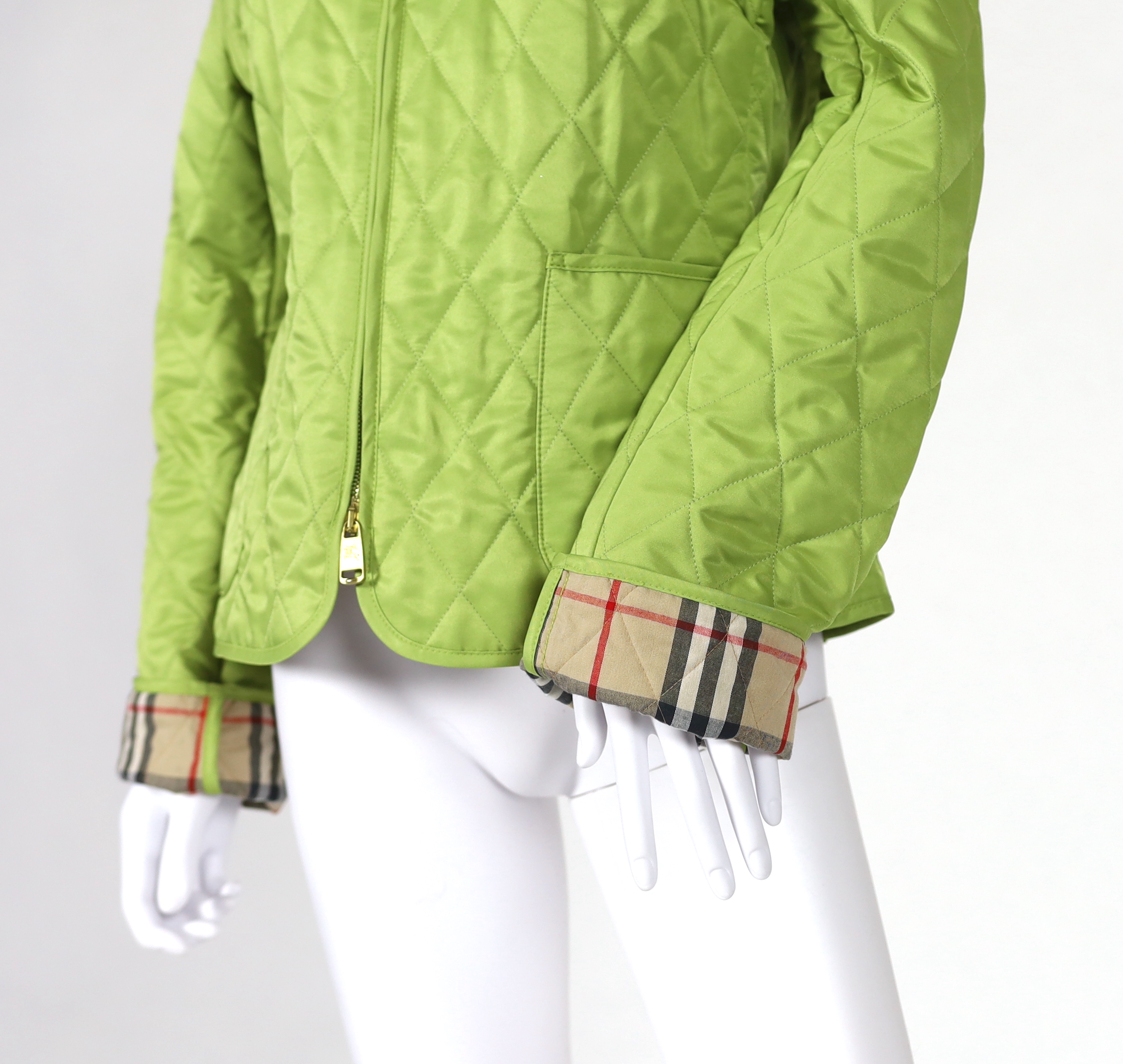 Two Burberry lady's quilted jackets, one pink and the other green, size Medium